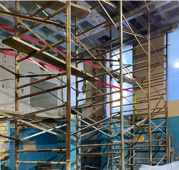 Intricate GASS aluminum shoring supports a decorative ceiling